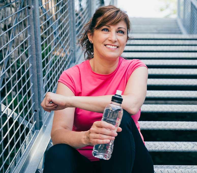 Mature woman enjoying a jog after improved health from chiropractic