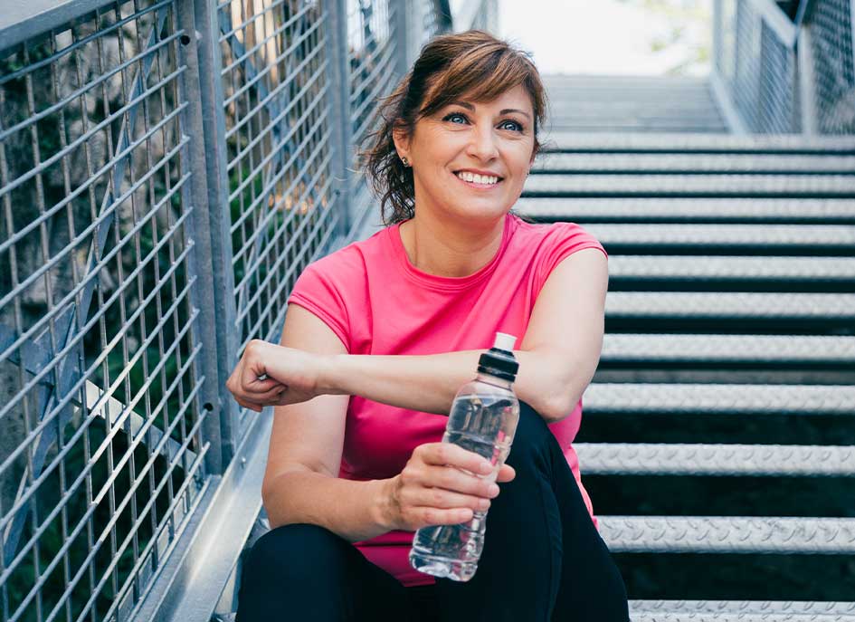 Mature woman enjoying a jog after improved health from chiropractic