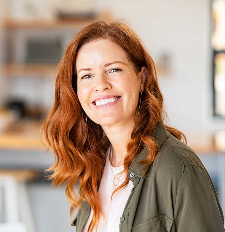 Woman smiling because of improved life quality from chiropractic