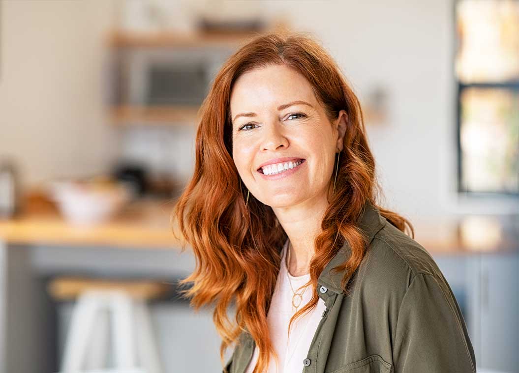 Woman smiling because of improved life quality from chiropractic