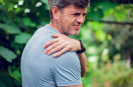 Man suffering from Frozen Shoulder