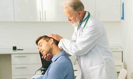 Chiropractor performing adjustment to relieve headache