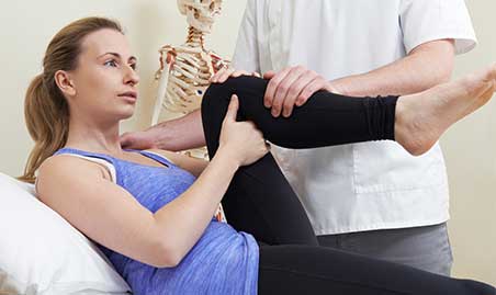 Chiropractor examines hip for cause of hip pain
