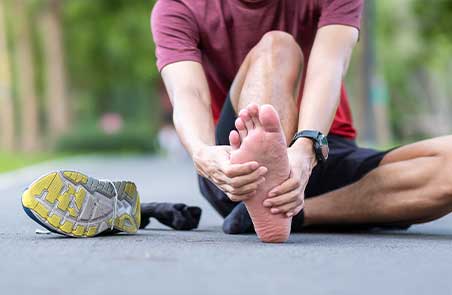 man suffering from plantar fasciitis